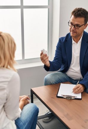 middle-age-man-woman-pshychologist-patient-having-pshychology-session-prescribing-pills-psychology-center